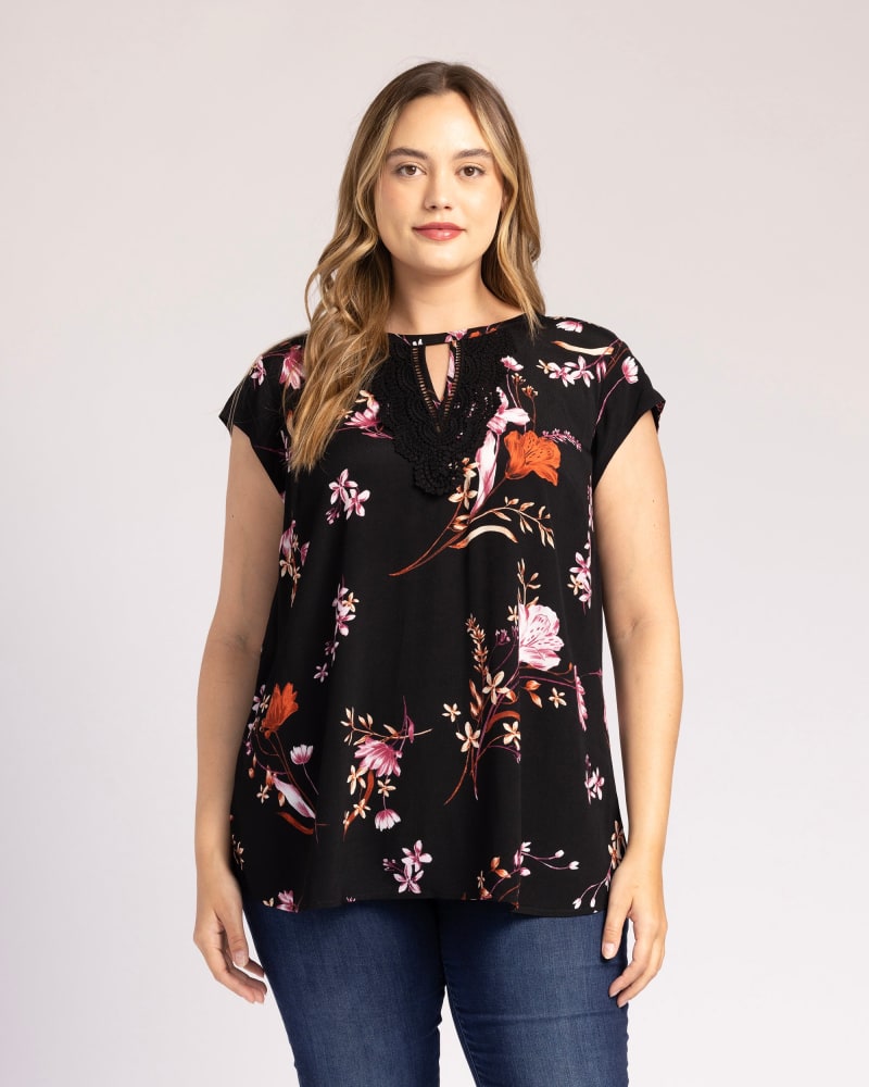 Front of a model wearing a size 1X Addisyn Floral Cap Sleeve Top in I936 BLACK by Daniel Rainn. | dia_product_style_image_id:303042